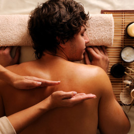 young guy in a beauty salon getting massage